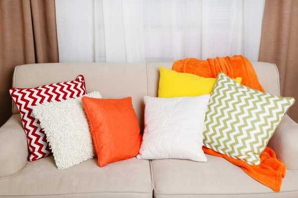 Adding Throw Pillows and Blankets for Comfort and Style