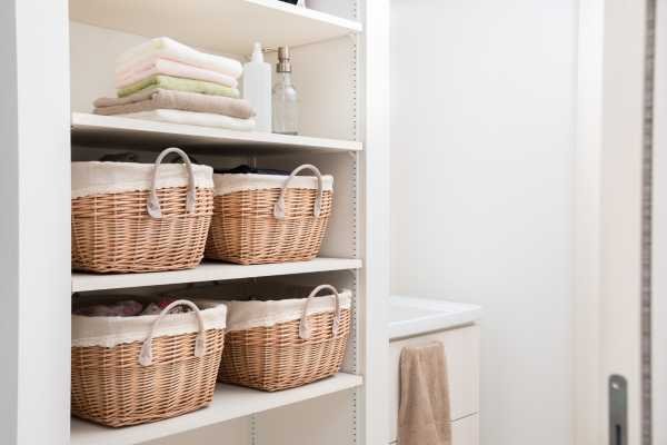 Using Baskets and Containers Organize Open Shelves in Living Room