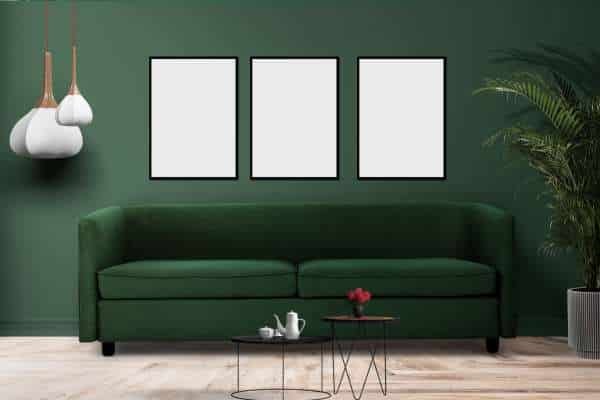 Art and Wall Decor: Making a Statement Behind Your Green Sofa