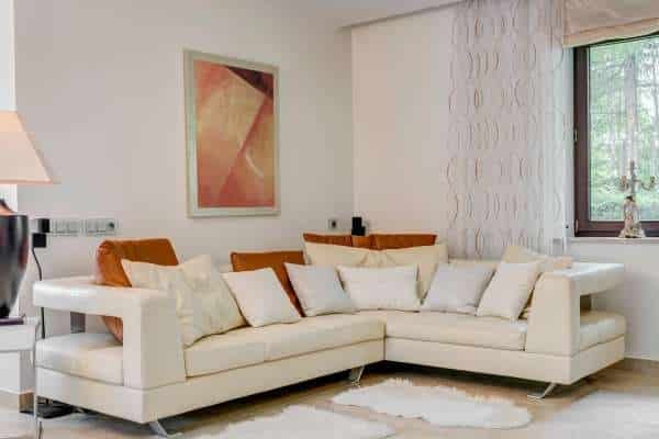 Creating a Focal Point with Art and Decor For Cream Sofa