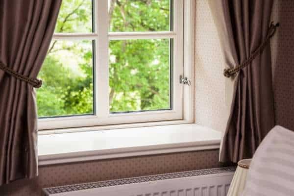 Choosing the Right Curtains and Window Treatments For brown couches